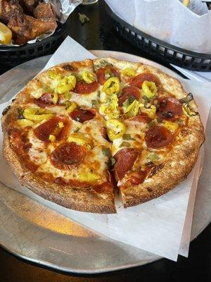 6 piece pizza (small) with pepperoni, green peppers, and banana peppers