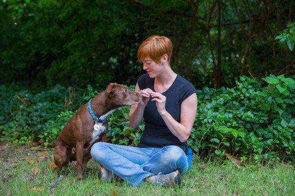 Erika offers "Burrito" a yummy treat for sitting nicely.