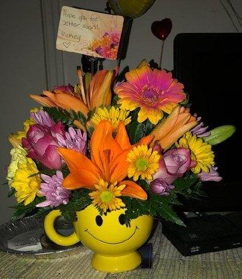 Beautiful, vibrant, colorful flowers in the cutest coffee cup and it doesn't even have our dog's photo on it!