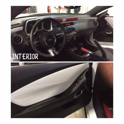 Interior: White w/ red stripes across dash to mimic exterior & white vinyl on door panels.