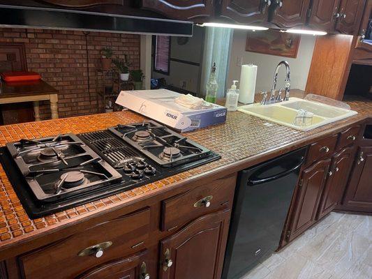 Before. Older tiled countertop.