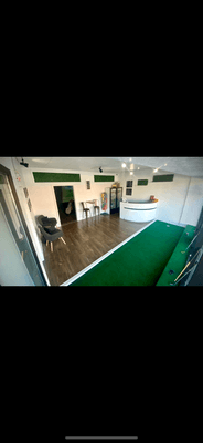 Welcoming reception area with 17-foot long putting green.