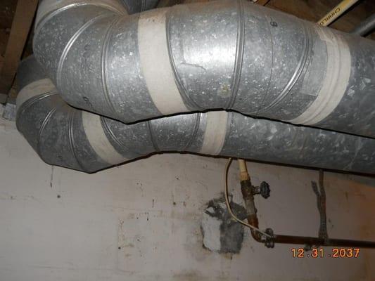 Did you know this type of duct tape is asbestos? This should be removed and replaced by a professional or covered with mastic...