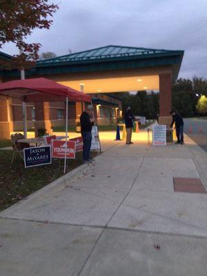 Main entrance to school with both political parties tents set up