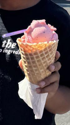 Strawberry gelato in waffle cone