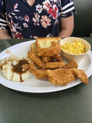 The chicken strip dinner with mashed potatoes and corn.