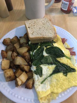 Omelette special, ham and spinach with mozzarella and feta cheese.