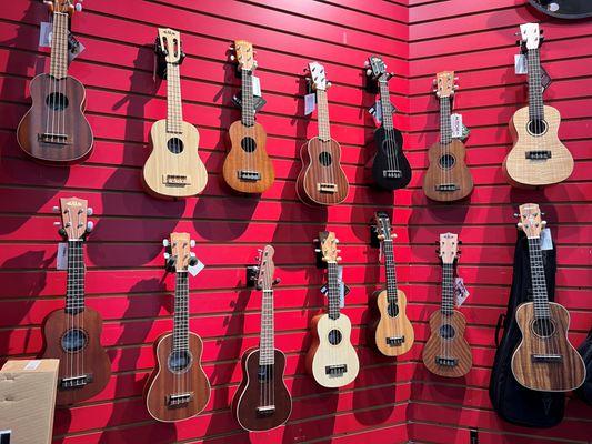 Ukulele's hanging on the wall.