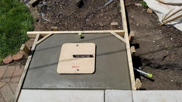 Concrete base with my gas line and bolt template installed