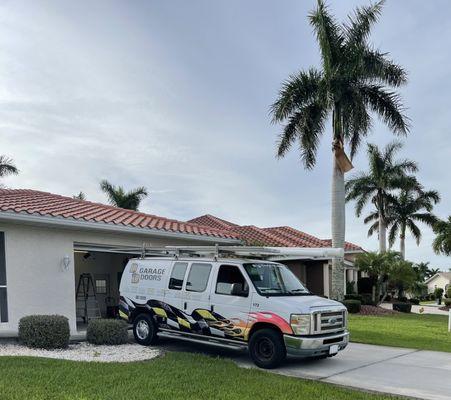 The mobile service working on the garage doors.