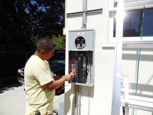 Jessy is helping in the installation of a 200 amp service.