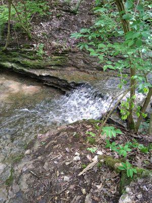 Small waterfall above the pool near the sinkhole.