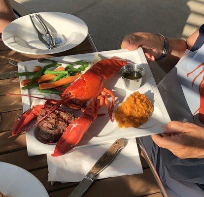 Whole Lobster with sirloin steak. Mashed sweet potatoes and mixed vegetables.