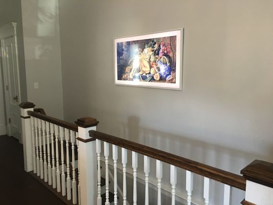 Over staircase, facing kitchen