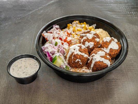 Falafel Tabaq (rice bowl with falafel, hummus and salad-- topped with our Mazaa sauce)