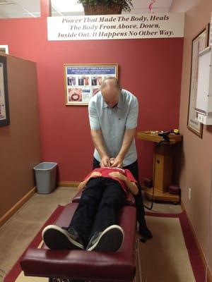 Dr Shaw gives 11 year old Sammy his weekly adjustment.