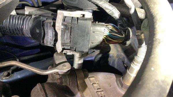 Damaged engine wiring harness.