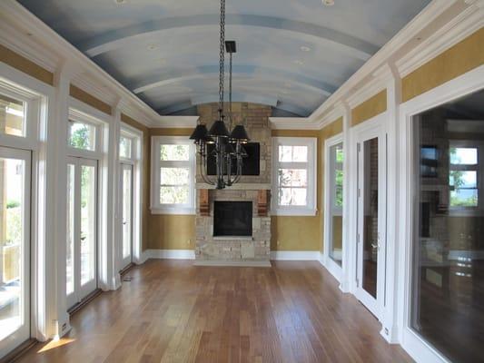 The faux finishes on the walls and ceiling add color and interest to this dining room.