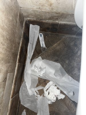 Needles wrapper and toilet paper with feces and blood