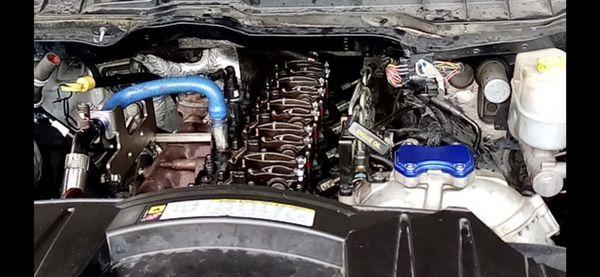 Here we have a 2011 Dodge 2500 with a 6.7 L Cummins diesel engine here we did head gasket head studs and full delete