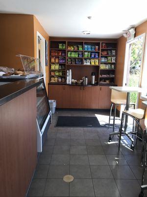 Wall of chips, snacks and coffee condiments.