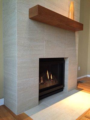 12 x 24 Italian porcelain tile fireplace with mitered corners. 16' high.