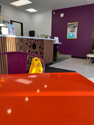 Lone table with sign advertising lemon Ice