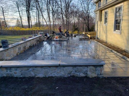 Stone wall with paver patio and bluestone caps