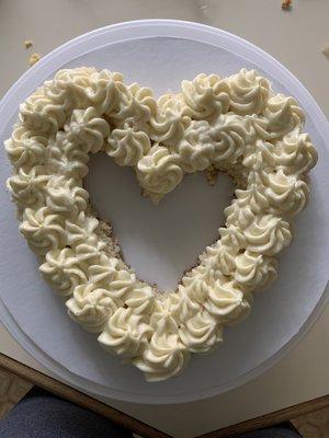 Coconut heart cake with coconut cream cheese buttercream!