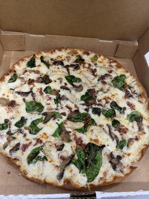 Chicken Alfredo on thin crust with spinach and mushrooms