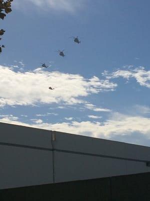 5 military helicopters overhead.