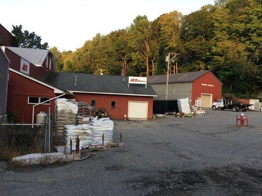 Extra garden and lawn materials outside the rear of the store