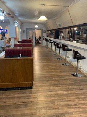 Upstairs bar area with booths and bar seating.