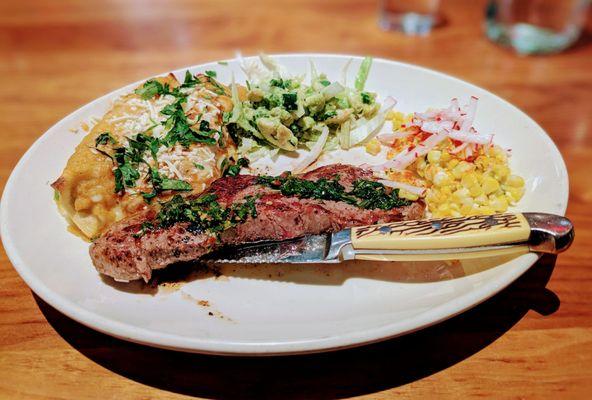 Steak and enchilada plate