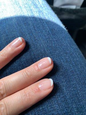 Uneven nail polish and very thin French tips.