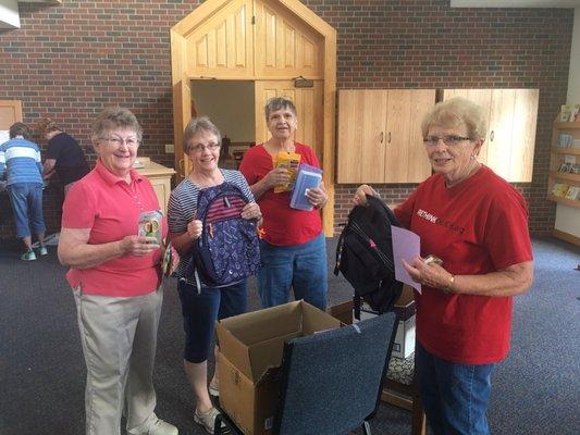 Working together to donate school supplies.