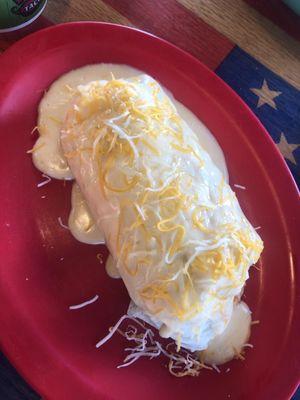 Potato Egg & Cheese Burrito smothered in Queso