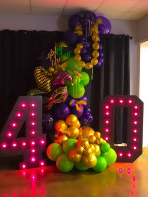 A taste of Mardi Gras for a 40th birthday at Treehouse Winery. Balloon decor with marquee lit numbers. Give us a call 980-272-8455