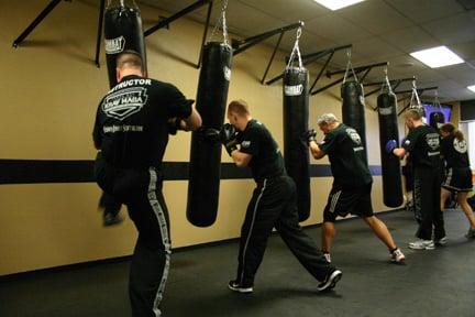 Tampa Bay Krav Maga Instructors and Elite Team doing some bag work before a class starts.