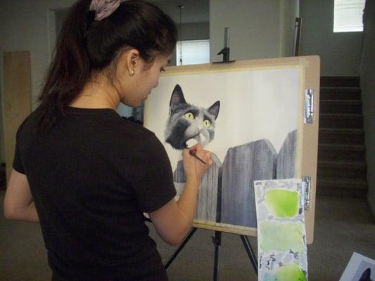 Student working on her watercolor.