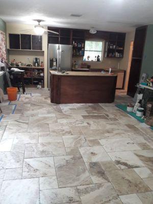 Custom island, travertine flooring.