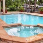 Geometric pool with a spa and in-pool table.