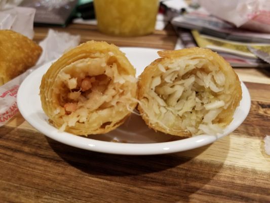 Inside of egg rolls,  nearly all bland cabbage! Boo... Left is pork,  right shrimp