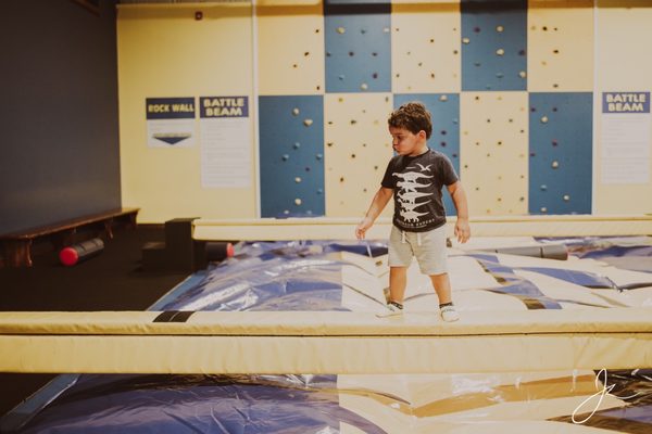 Walking the beam can be fun for a toddler.