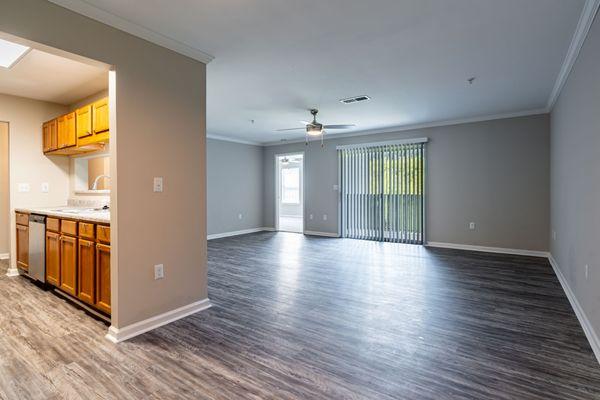 Lancaster Place Apartments in Calera, Alabama photo of a living room and kitchen.