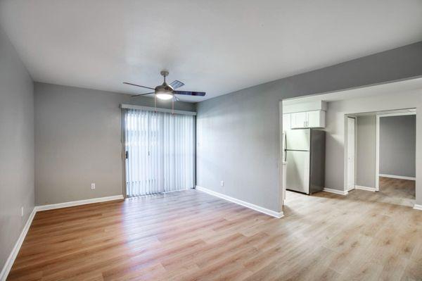 living room with ceiling fan and fauxwood flooring