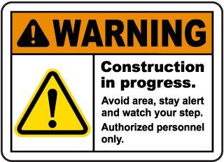 Warning sign that informs you that construction is in progress, and that everyone has to stay alert a active