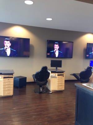 Treatment room with TVs to distract you while you are getting your braces on!