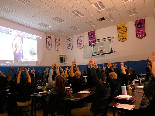 Finally made it on to the big screen! Enjoying leading a team in some corporate wellness practices.