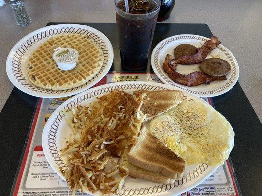 Pecan waffle, 2 eggs over easy, sausage, bacon and hash browns.